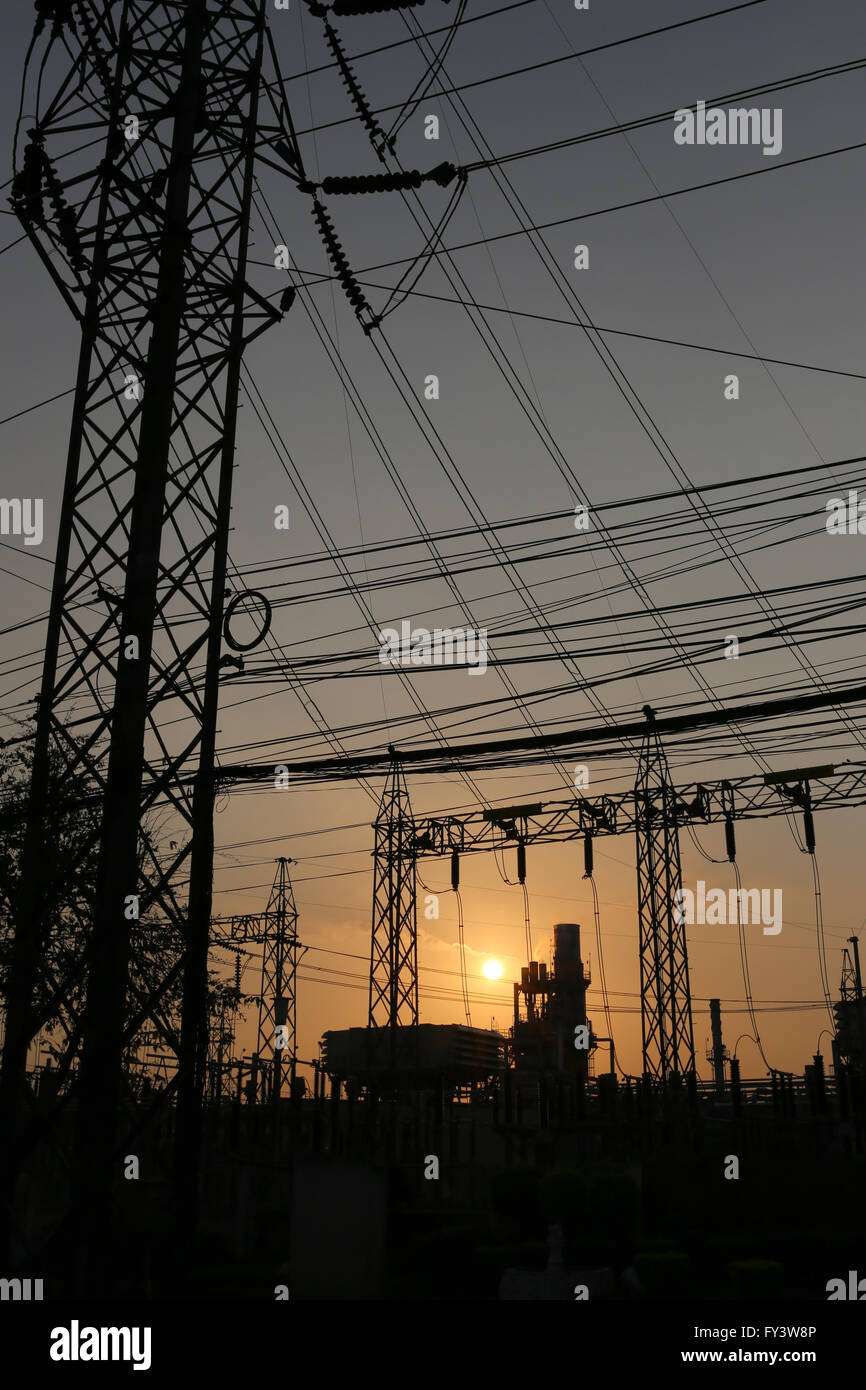 Power plants of silhouette style in the evening sunset. Stock Photo