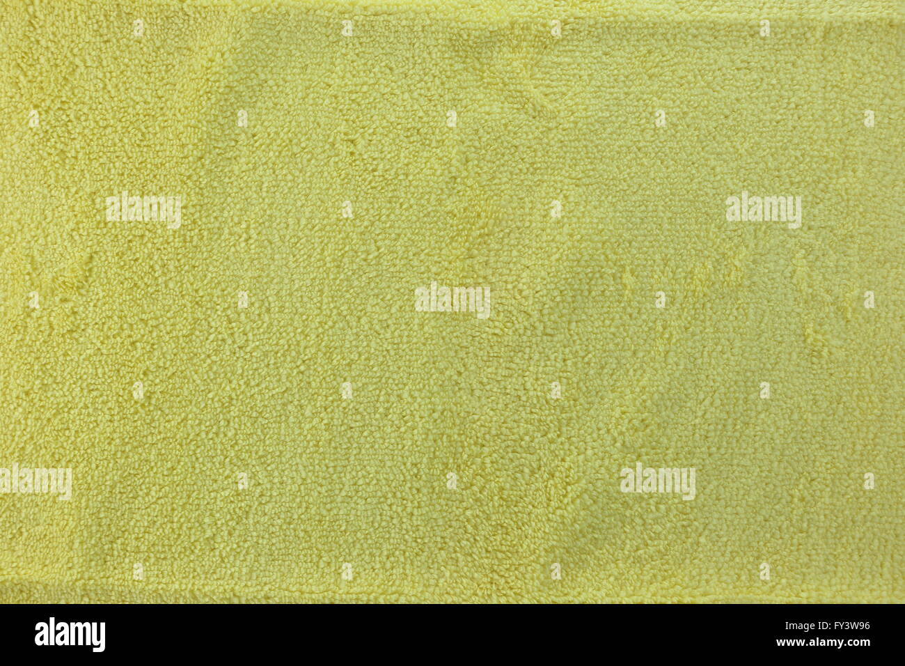 Yellow color Texture of microfiber Cloth for the design background. Stock Photo