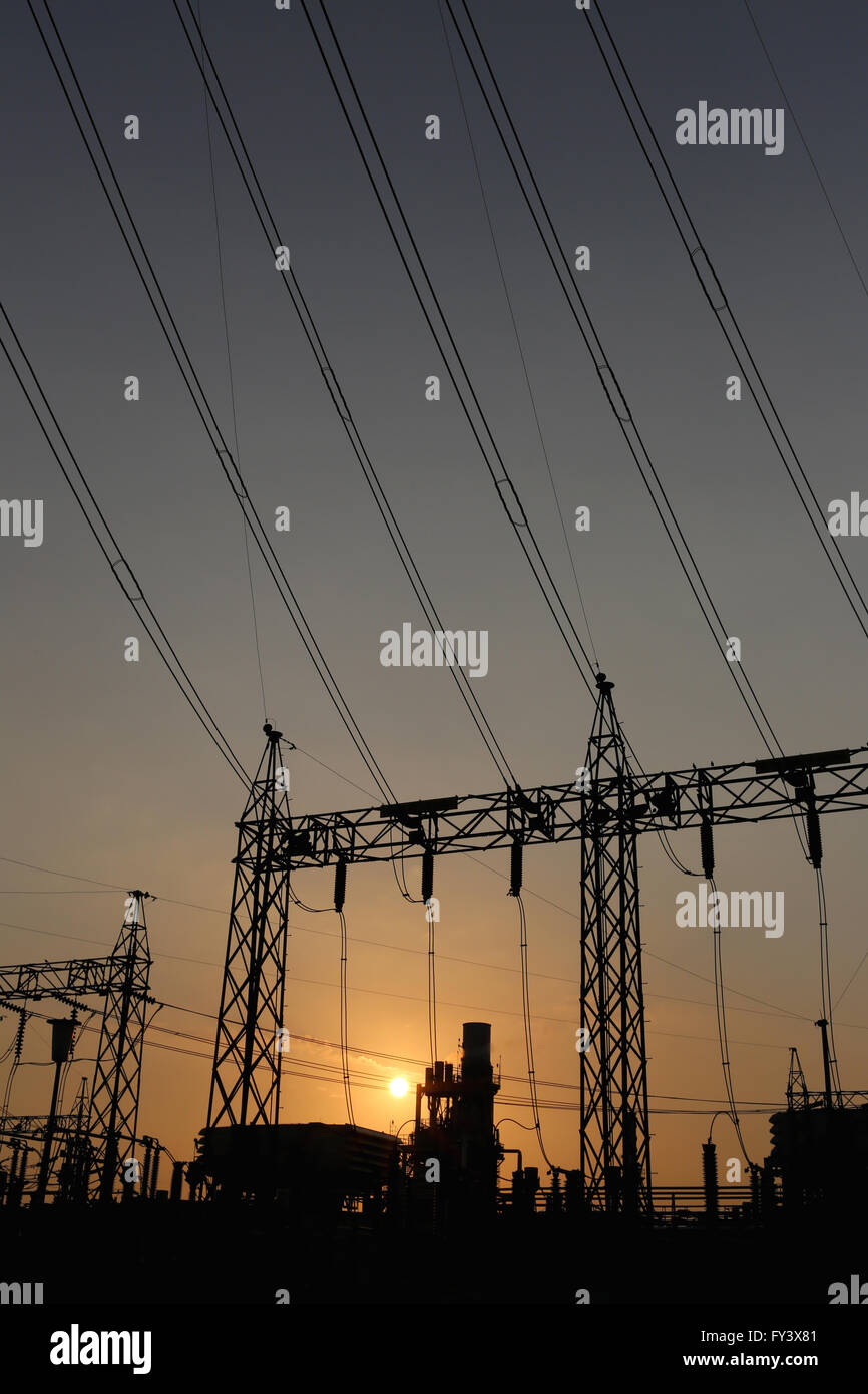 Power plants of silhouette style in the evening sunset. Stock Photo