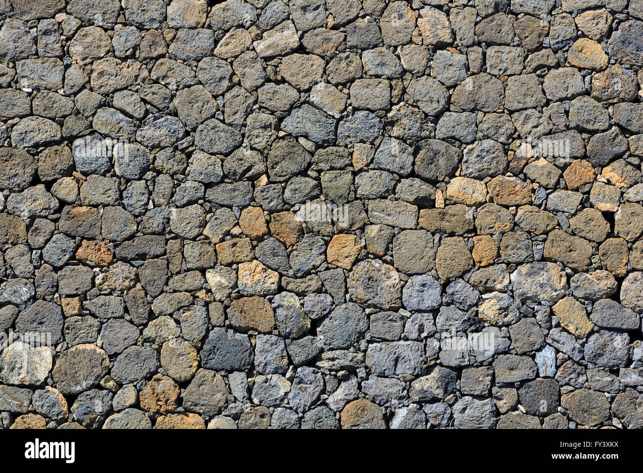 Wall built of lava boulders abstract Mount Teide Tenerife