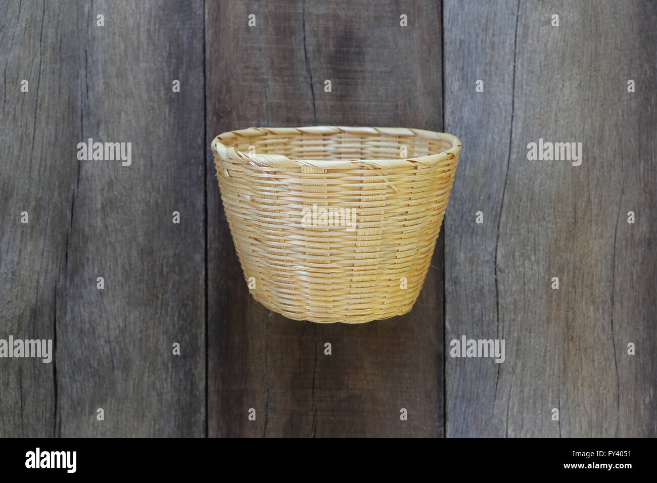 Basket weave of handicraft on old wooden for the design background. Stock Photo