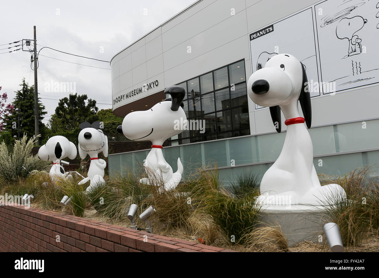 Tokyo, Japan. 21st Apr, 2016. Various statues of Snoopy on display at the entrance of the Snoopy