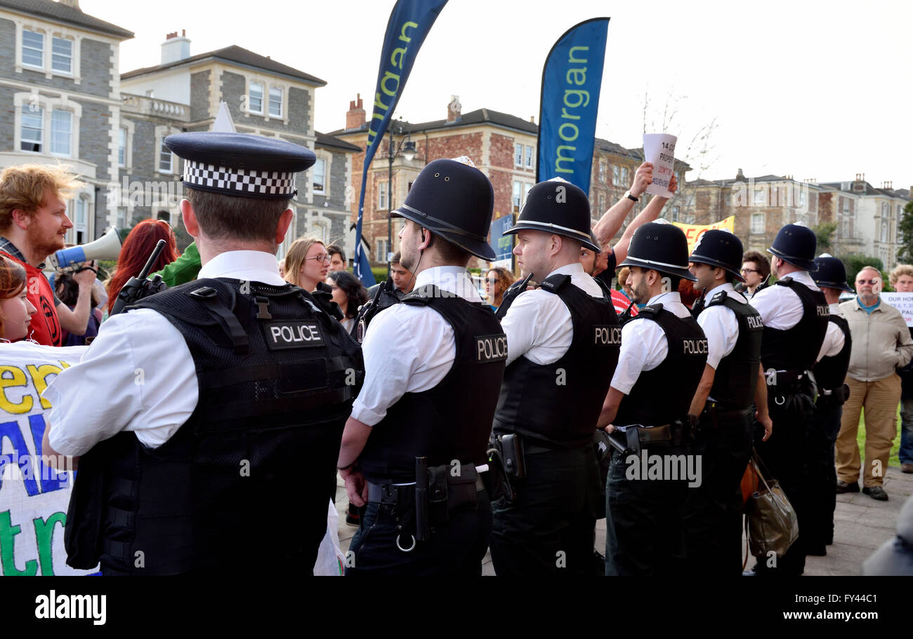 Bristol, UK. 20th April, 2016. Protest demonstration of Bristol City Council selling houses and flats by auction instead of refurbishing for residents. Line of police keeping the protesters from entering the auction building. Protest at All Saints Church on Pempbrooke Road, Bristol auction run by Hollis Morgan Property Ltd. attrated an estimated 100 protesters. © Charles Stirling/Alamy Live News Credit:  Charles Stirling/Alamy Live News Stock Photo