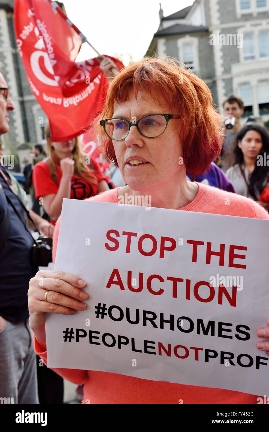 Bristol, UK. 20th April, 2016. Protest demonstration of Bristol City Council selling houses and flats by auction instead of refurbishing for residents. Woman protesting about council selling 15 residential properties instead of referbishing and letting them. Protest at All Saints Church on Pempbrooke Road, Bristol auction run by Hollis Morgan Property Ltd. attrated an estimated 100 protesters. Credit:  Charles Stirling/Alamy Live News Stock Photo