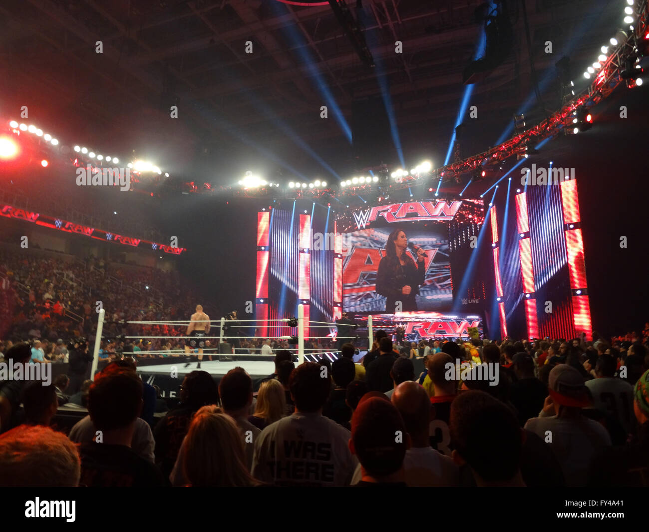 SAN JOSE - MARCH 30: The Beast Brock Lesner stands in the ring ready for action with Stephanie McMahon on screen holding mic during live taping of WWE Monday Night Raw at the SAP Center in San Jose, California on March 30, 2015. Stock Photo