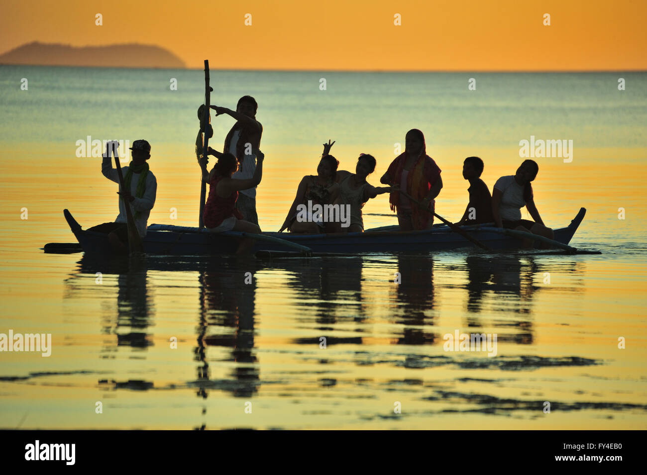 Paddling at sunset, Siquijor Island, Philippines. Stock Photo