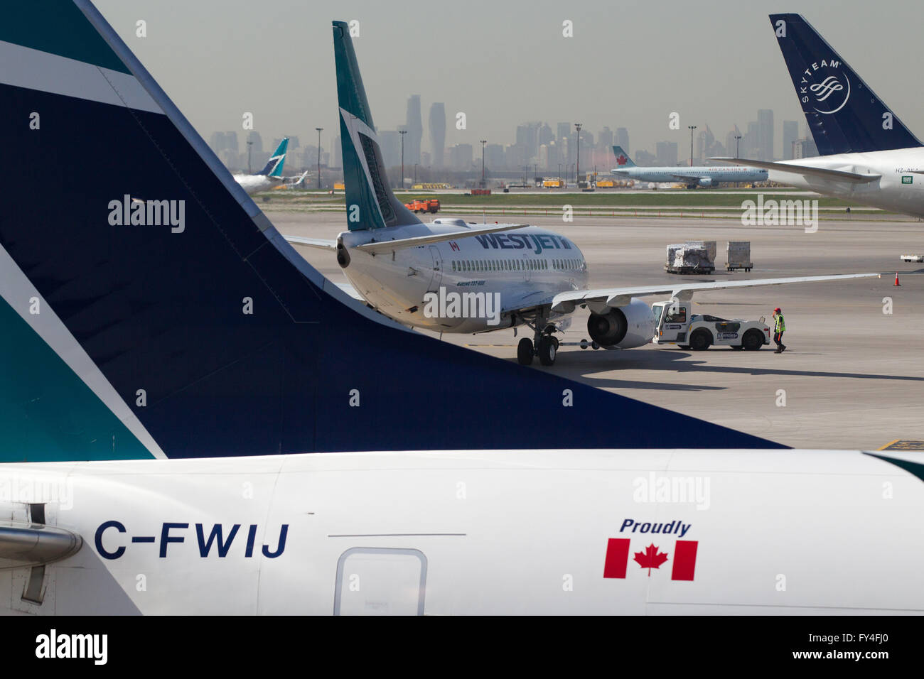 Westjet planes on the tarmac at Toronto Pearson airport in Toronto, Ont., on May 7, 2015. Stock Photo