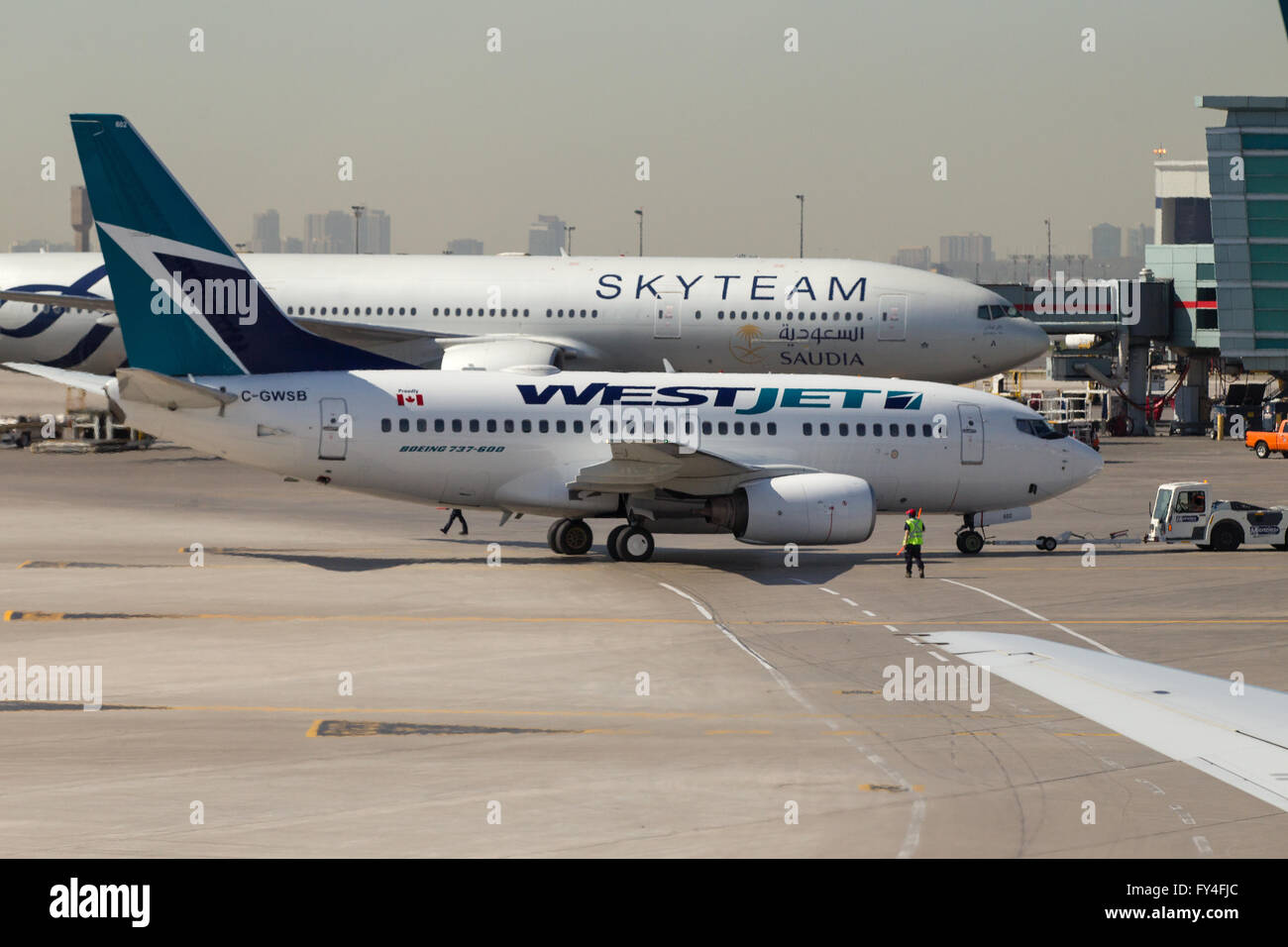 Westjet plane on the tarmac at Toronto Pearson airport in Toronto, Ont., on May 7, 2015. Stock Photo