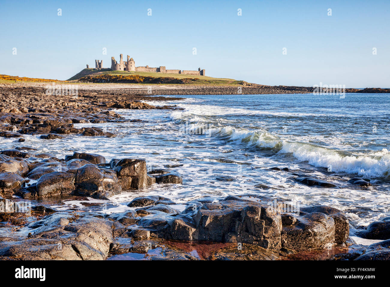 Dunstanburgh Castle on the Northumberland coast, North East England. Stock Photo