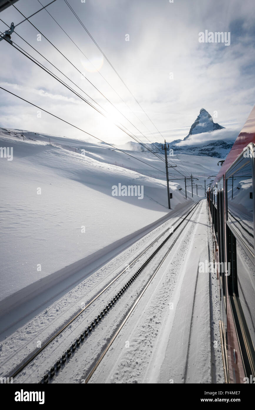 The Matterhorn is visible from a train of the famous Gornergrat railway that leads from the village of Zermatt up to 3089m. Stock Photo