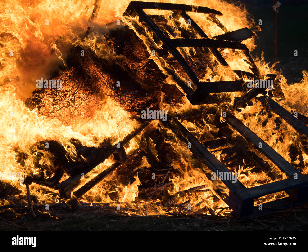 full frame of a lit fire beacon bonfire campfire of burning pallets for queen's 90th birthday in Whitwell, Isle of Wight, UK Stock Photo