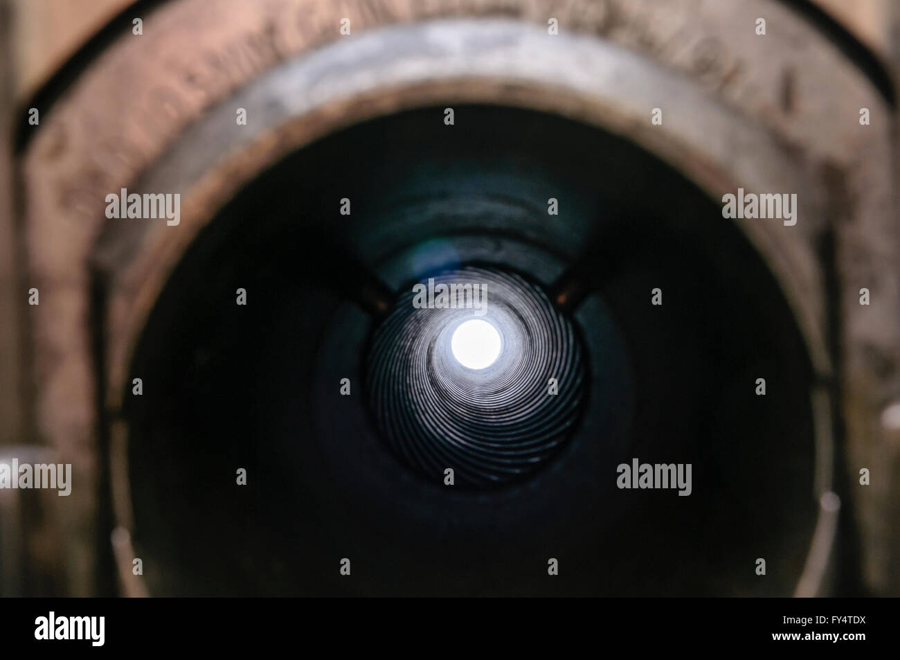 View through the barrel of a 105mm Light Field Gun Howitzer showing spiral rifling which spins the shell and improves accuracy Stock Photo