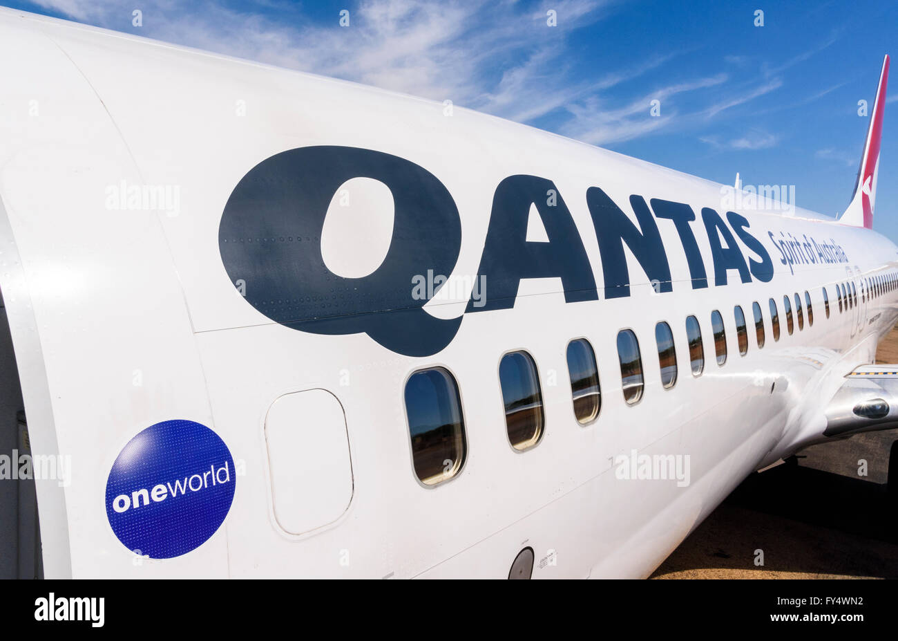 Qantas lettering on the fuselage of a Qantas Boeing 737-800 aeroplane at Broome Airport, Kimberley, Western Australia Stock Photo
