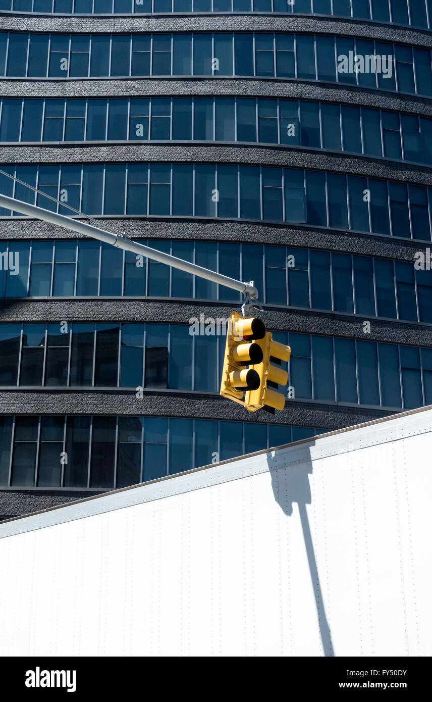 Traffic light against modern skyscraper in New York City Stock Photo