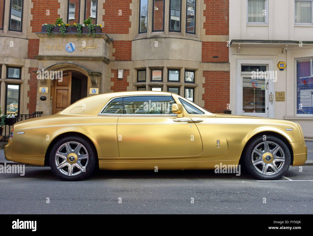 Gold painted Rolls Royce Wraith from Saudi Arabia parked in Mayfair, London Stock Photo