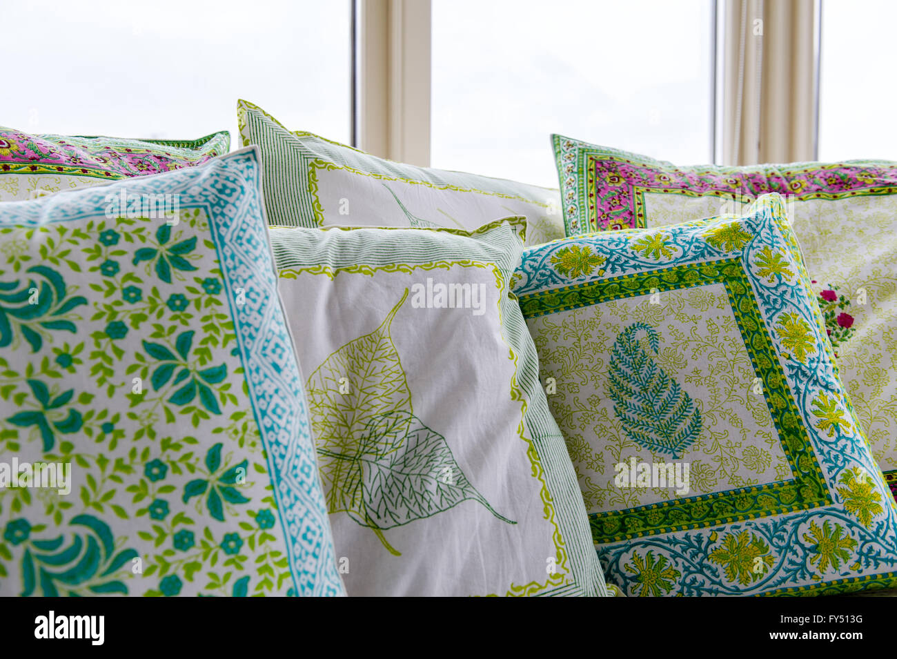 Decorative cushion covers from India in a conservatory. Stock Photo