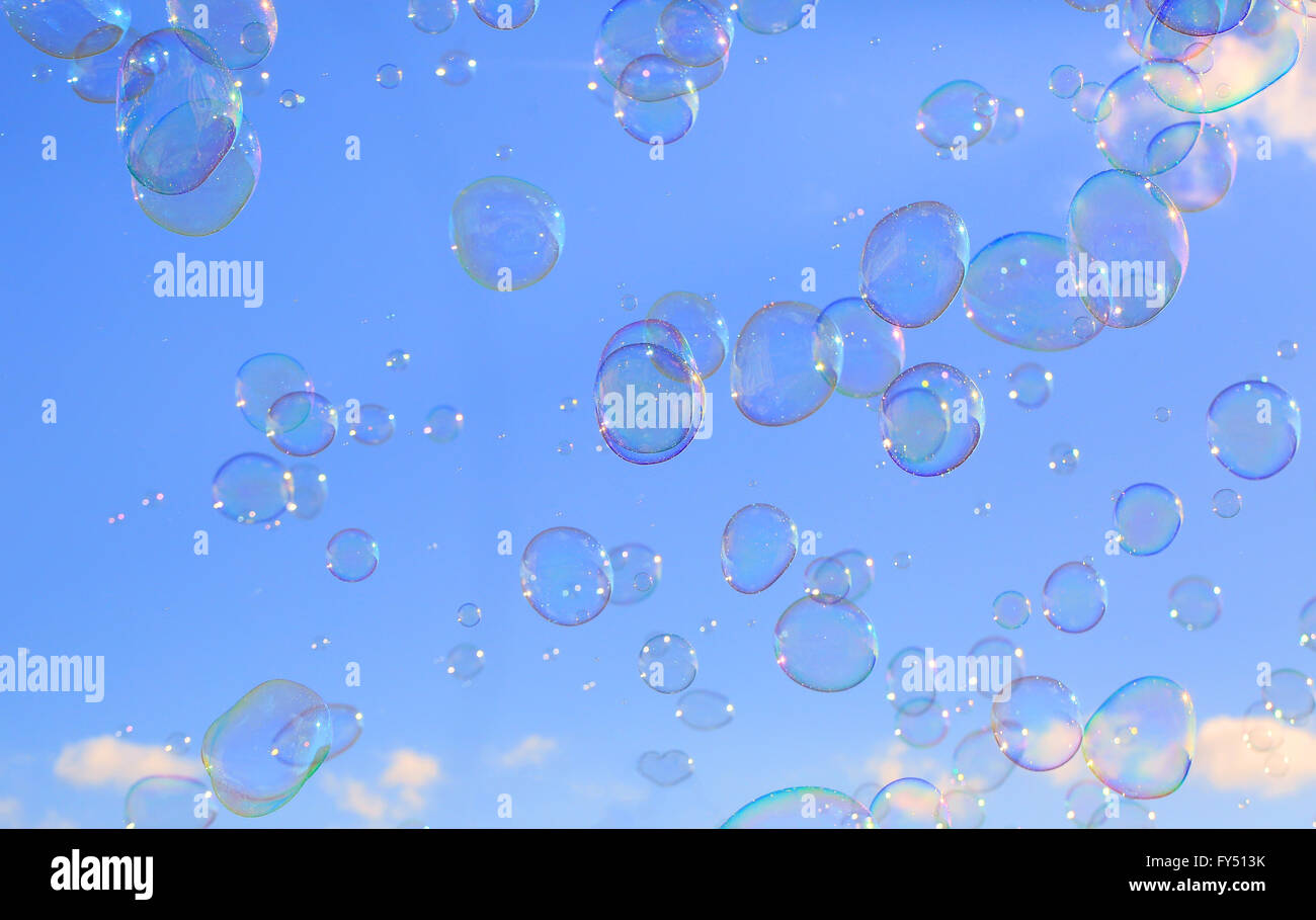 Delicate soap bubbles floating in a blue sky Stock Photo - Alamy