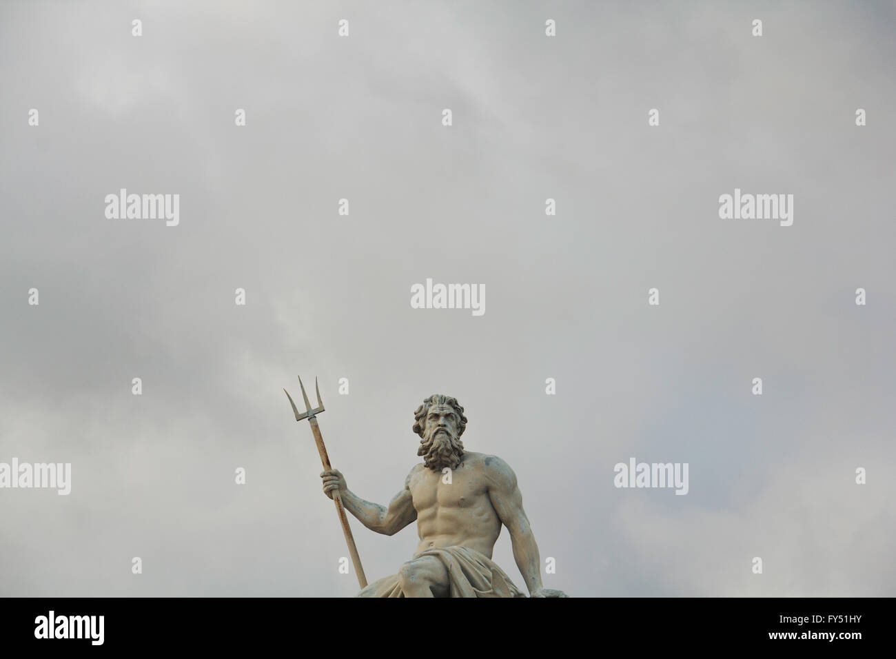 Statue of Neptune in Copenhagen, Denmark, against an overcast sky. Stock Photo