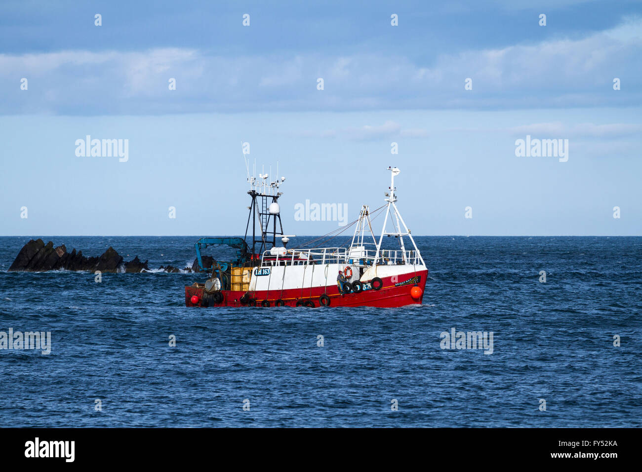 Fishing boat approaching Eyemouth harbour Stock Photo Alamy