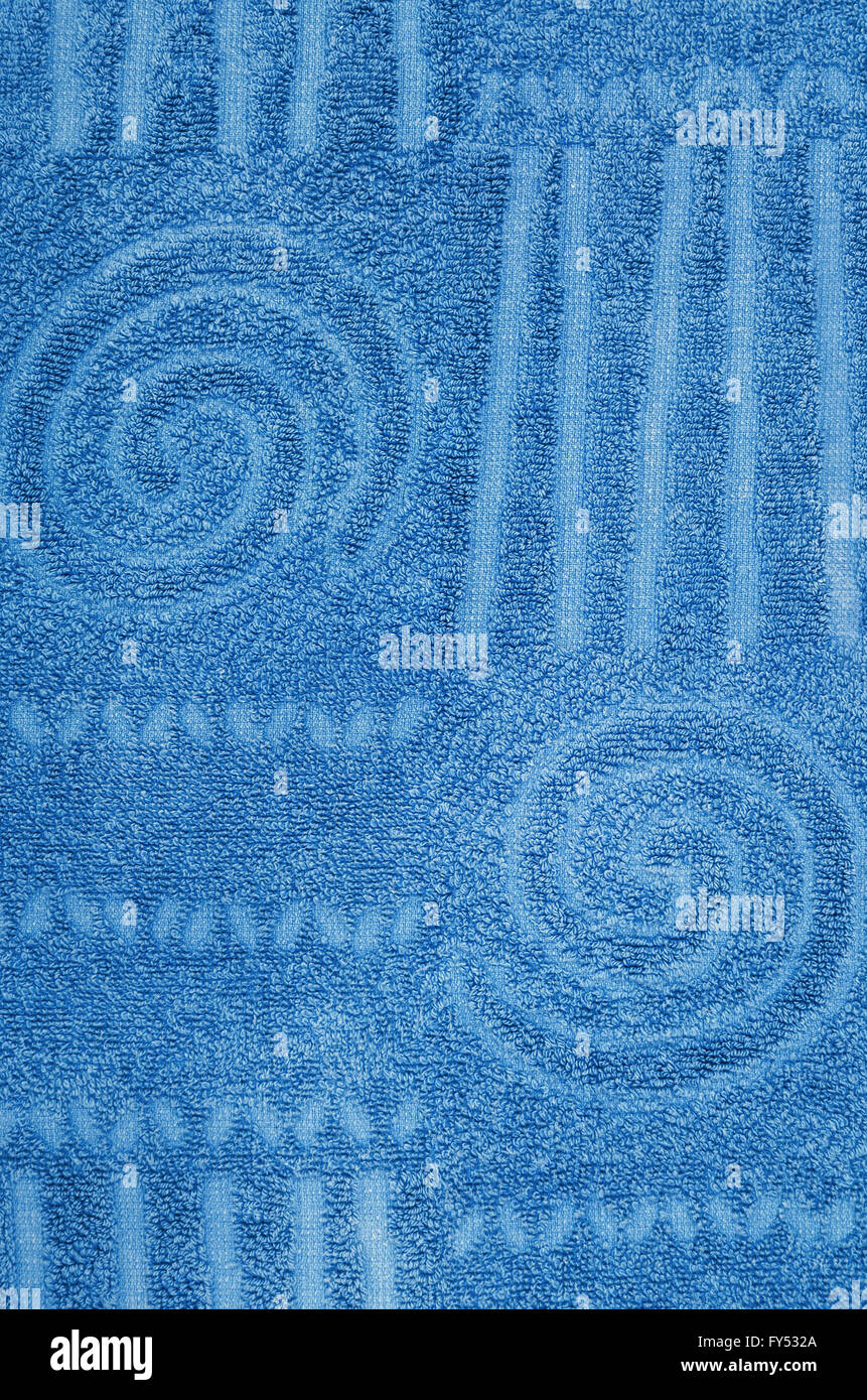 close up of a cyan, blue,  terry towel with geometrical and spiral pattern, vertical Stock Photo