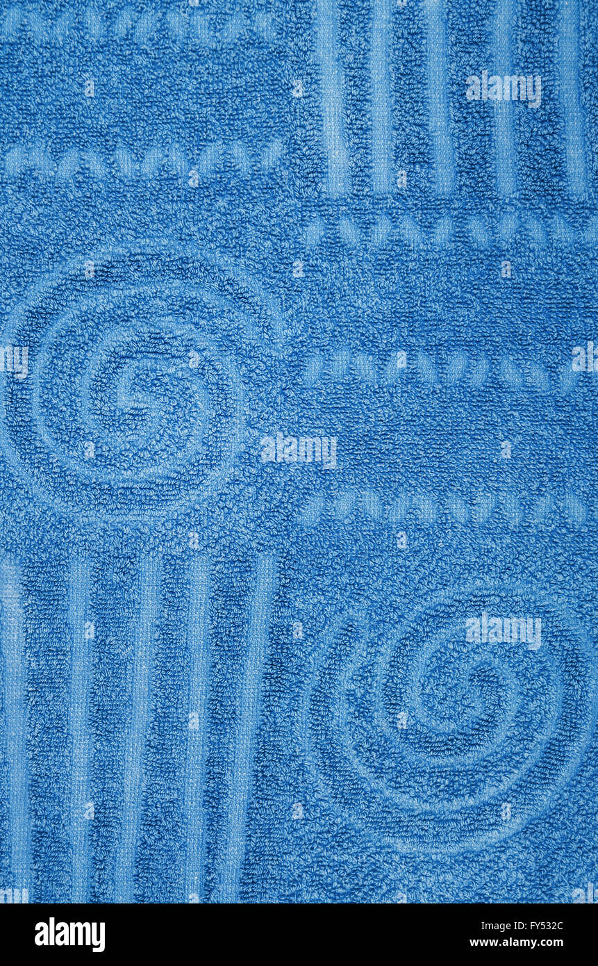 close up of a cyan, blue, terry towel with geometrical and spiral pattern, vertical Stock Photo