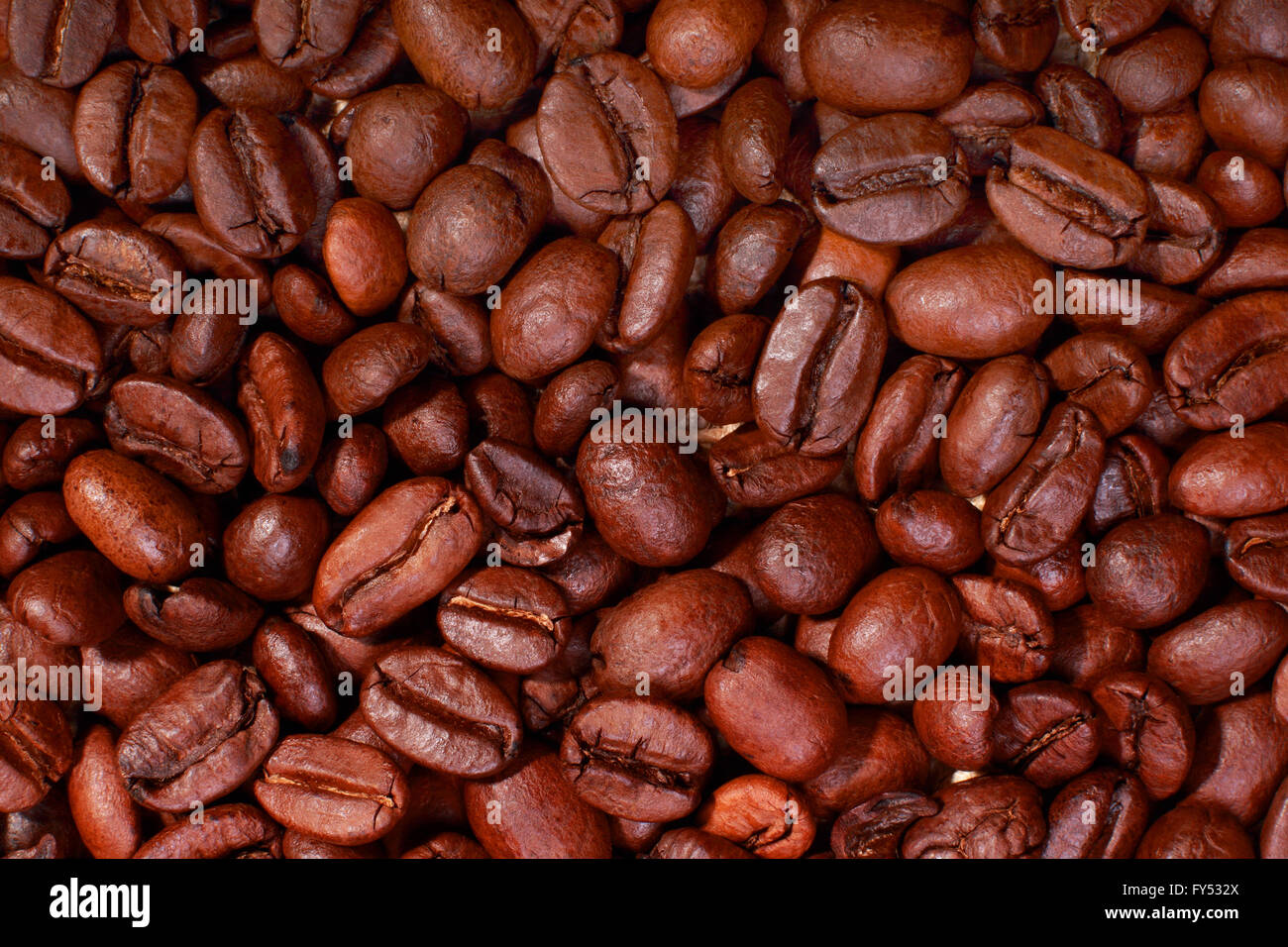 Roasted coffee beans background Stock Photo - Alamy