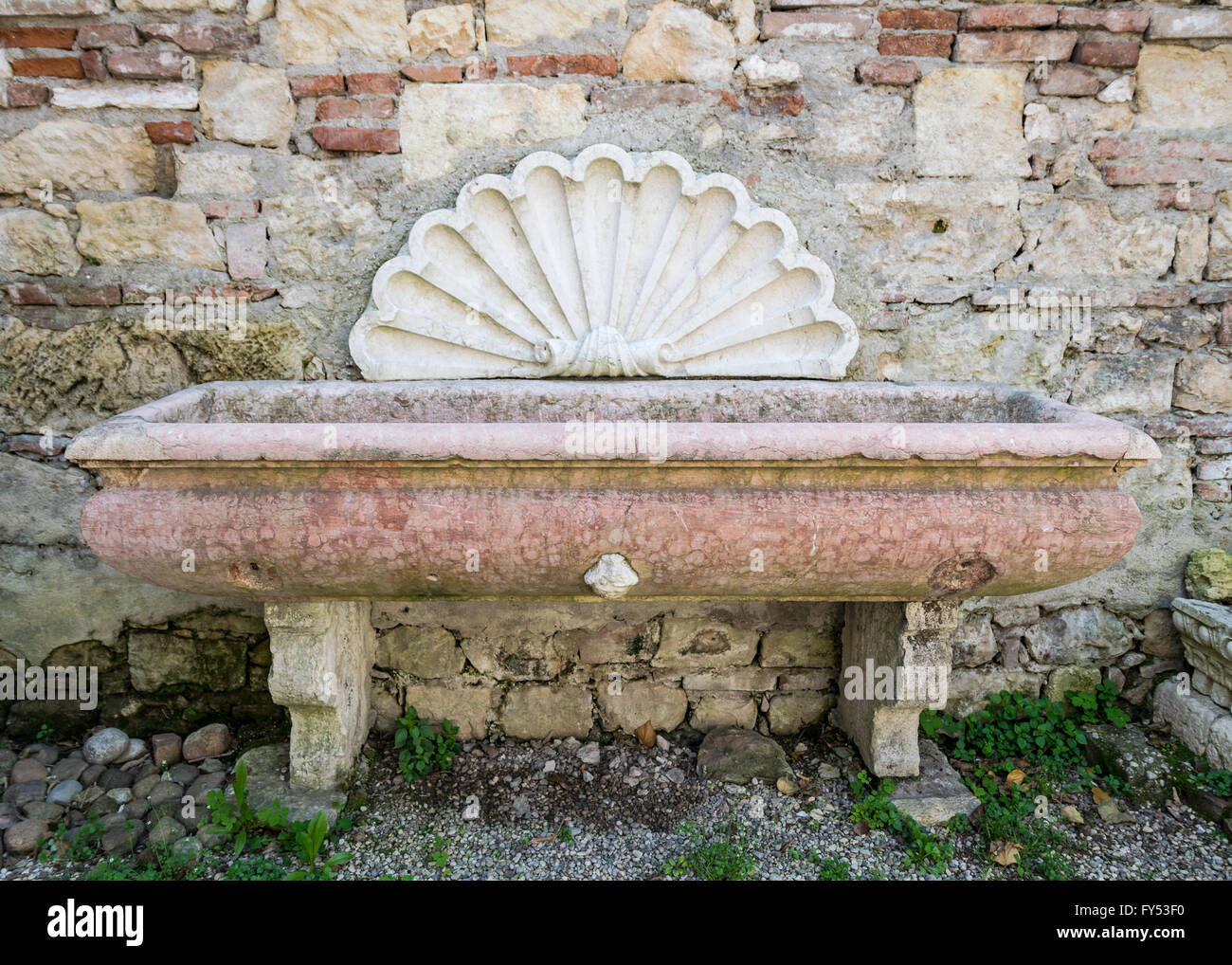 Ancient pink marble tub with white marble shell Stock Photo Alamy