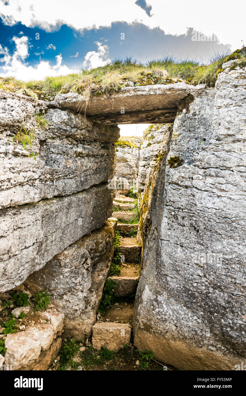 Trench dug in the rock dating back to World War I located on the Italian alps. Stock Photo