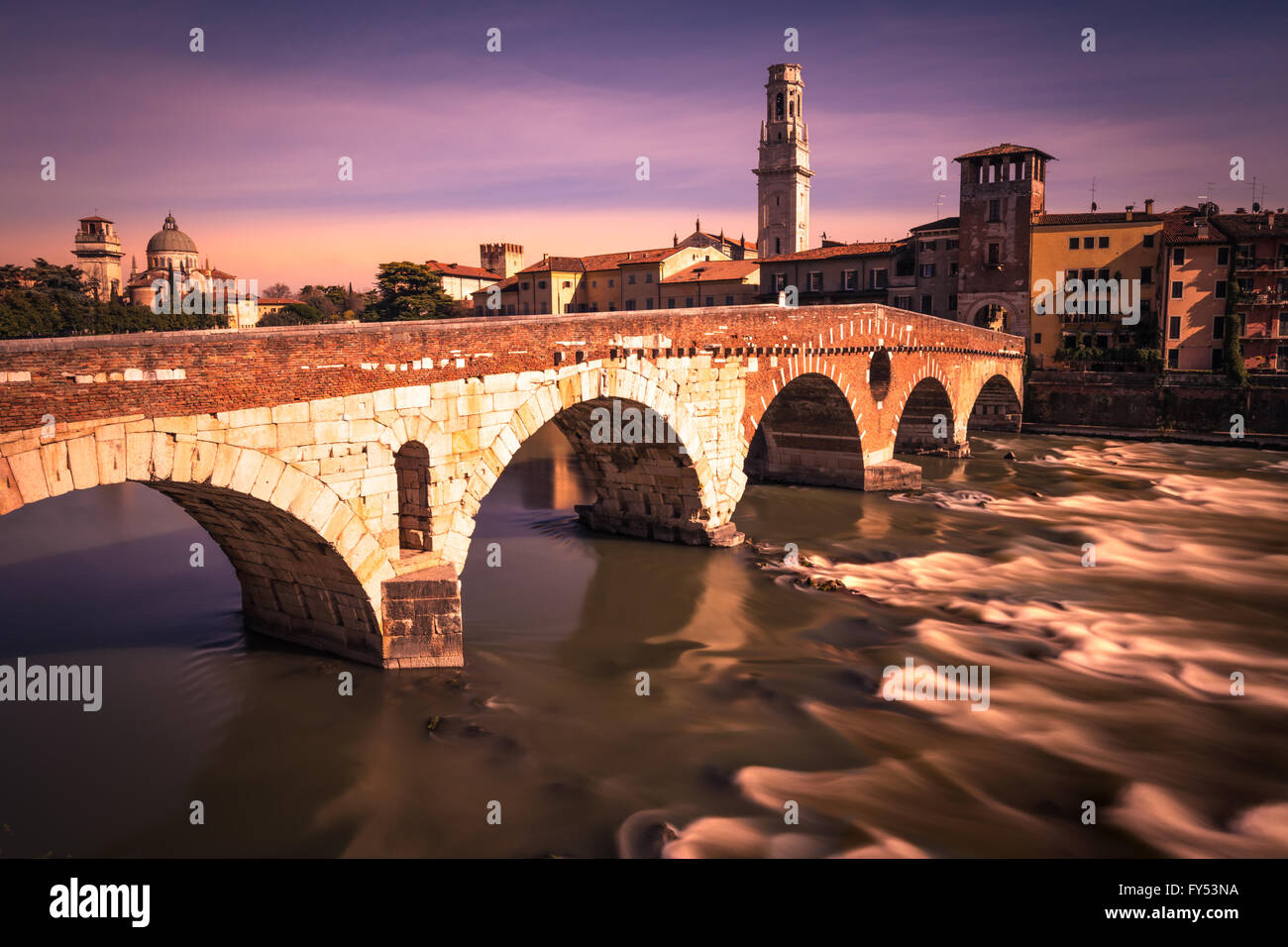 'Stone Bridge', the famous old bridge in Verona crosses the Adige river. Stock Photo