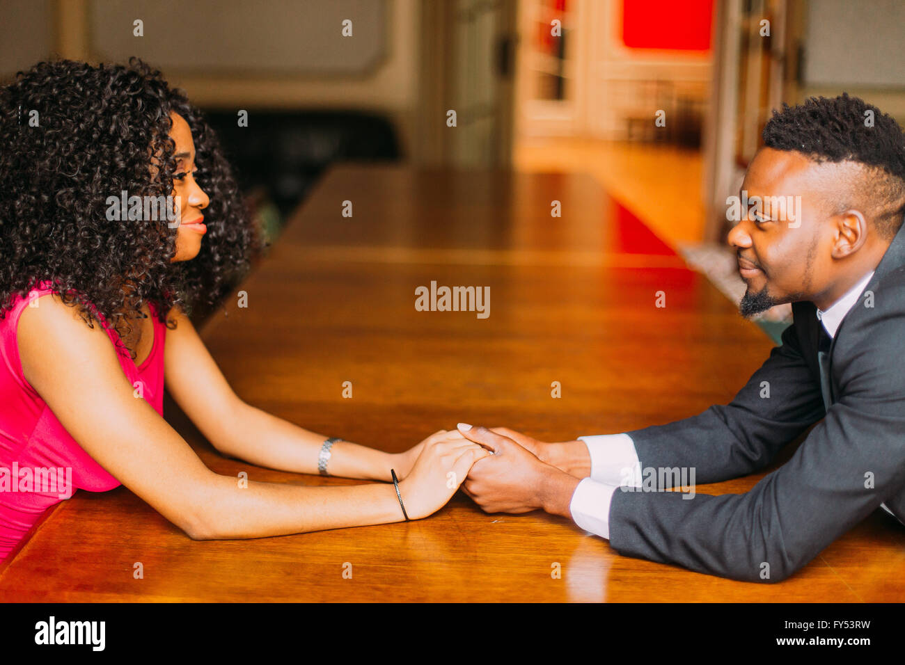 Portrait Of Young African Couple Holding Hands Stock Photo - Alamy