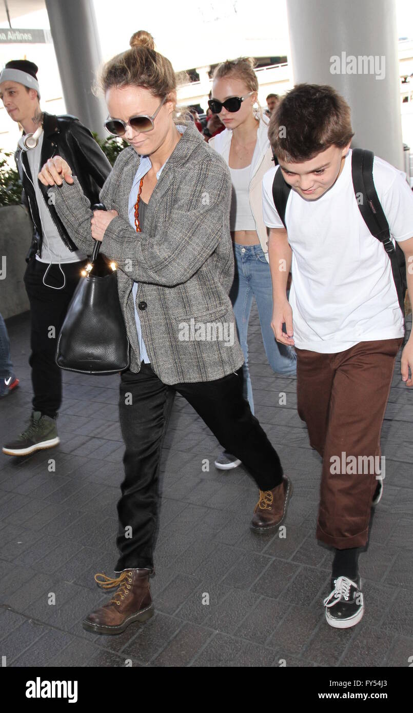 Lily Rose Depp, boyfriend Ash Stymest, brother John Depp, and mother Vanessa Paradis arrive at Los Angeles International Airport  Featuring: Lily Rose Depp, Vanessa Paradis, John Depp III, John Christopher Depp III Where: Los Angeles, California, United States When: 22 Mar 2016 Stock Photo