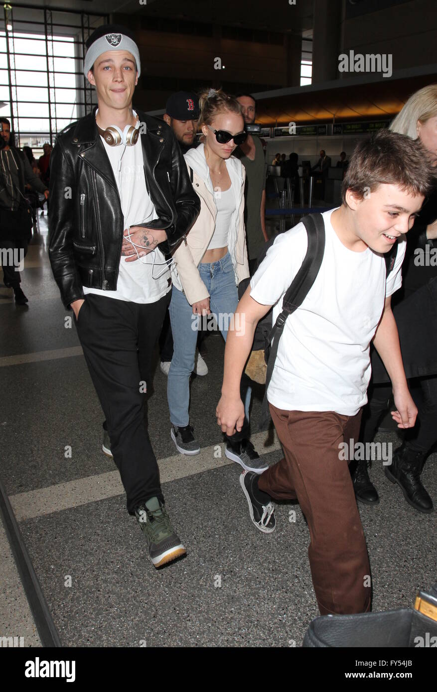 Lily Rose Depp, boyfriend Ash Stymest, brother John Depp, and mother Vanessa Paradis arrive at Los Angeles International Airport  Featuring: Lily Rose Depp, Ash Stymest, John Depp III, John Christopher Depp III Where: Los Angeles, California, United States When: 22 Mar 2016 Stock Photo