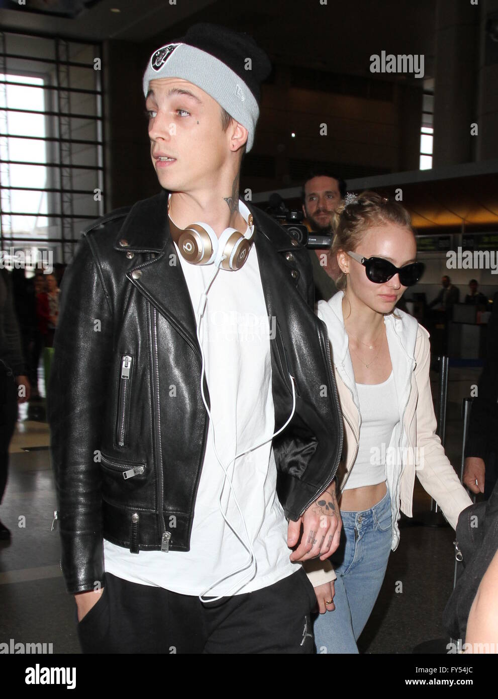 Lily Rose Depp, boyfriend Ash Stymest, brother John Depp, and mother Vanessa Paradis arrive at Los Angeles International Airport  Featuring: Lily Rose Depp, Ash Stymest Where: Los Angeles, California, United States When: 22 Mar 2016 Stock Photo