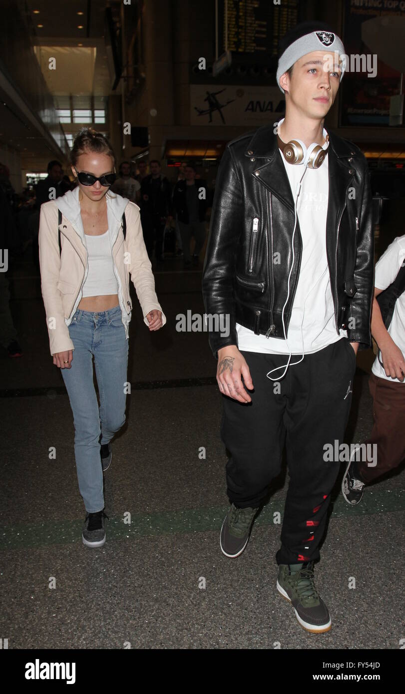 Lily Rose Depp, boyfriend Ash Stymest, brother John Depp, and mother Vanessa Paradis arrive at Los Angeles International Airport  Featuring: Lily Rose Depp, Ash Stymest Where: Los Angeles, California, United States When: 22 Mar 2016 Stock Photo
