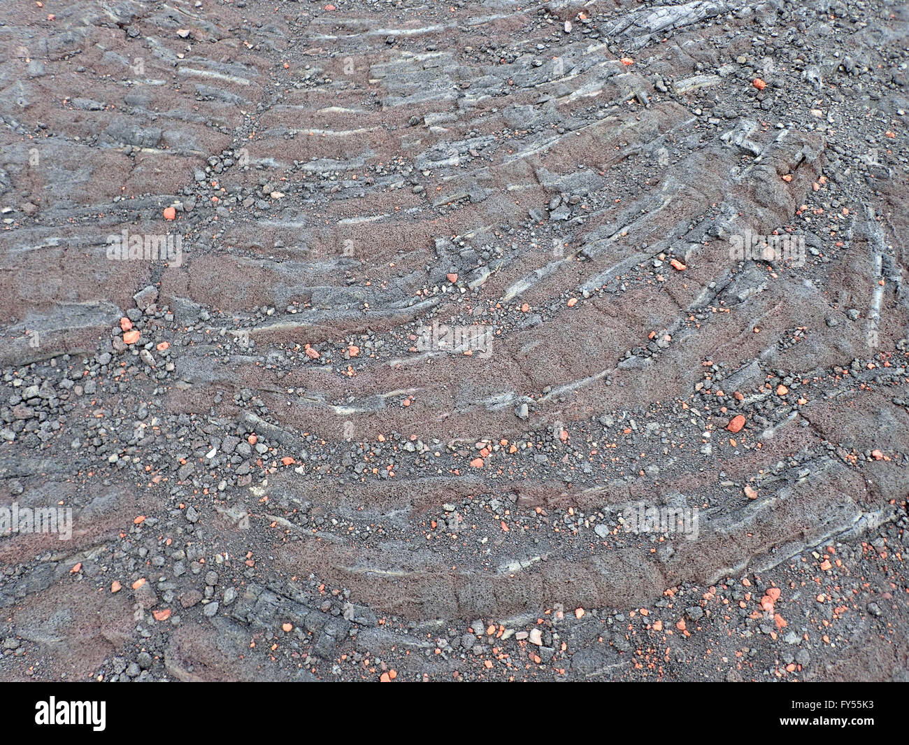 Ripples of Lava rock with small rocks on top on Big Island, Hawaii. Stock Photo