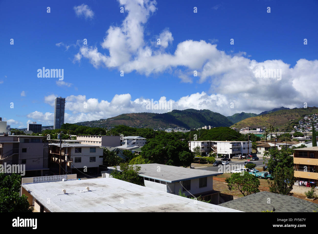 Kapahulu town in Honolulu with homes, condos, and mountains of Tantalus