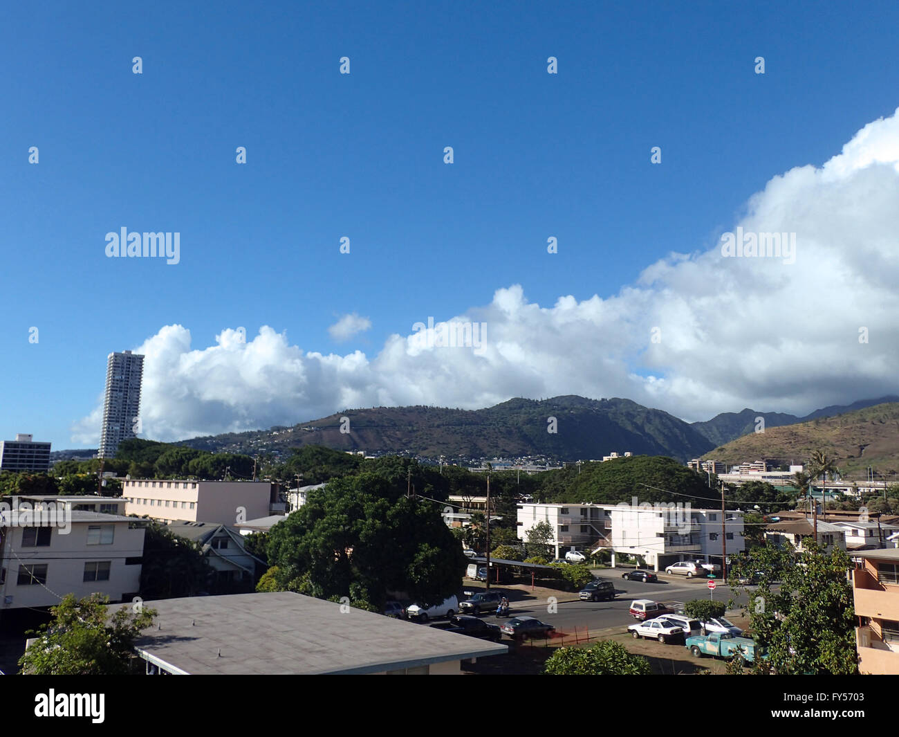 Kapahulu town in Honolulu with homes, condos, and mountains of Tantalus