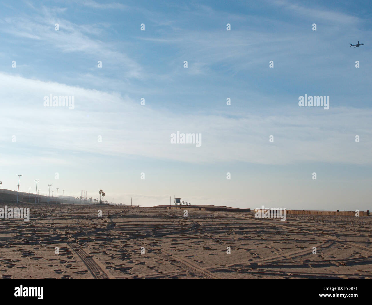 Tire Tracks In The Sand On An Empty Dockweiler Beach State Park