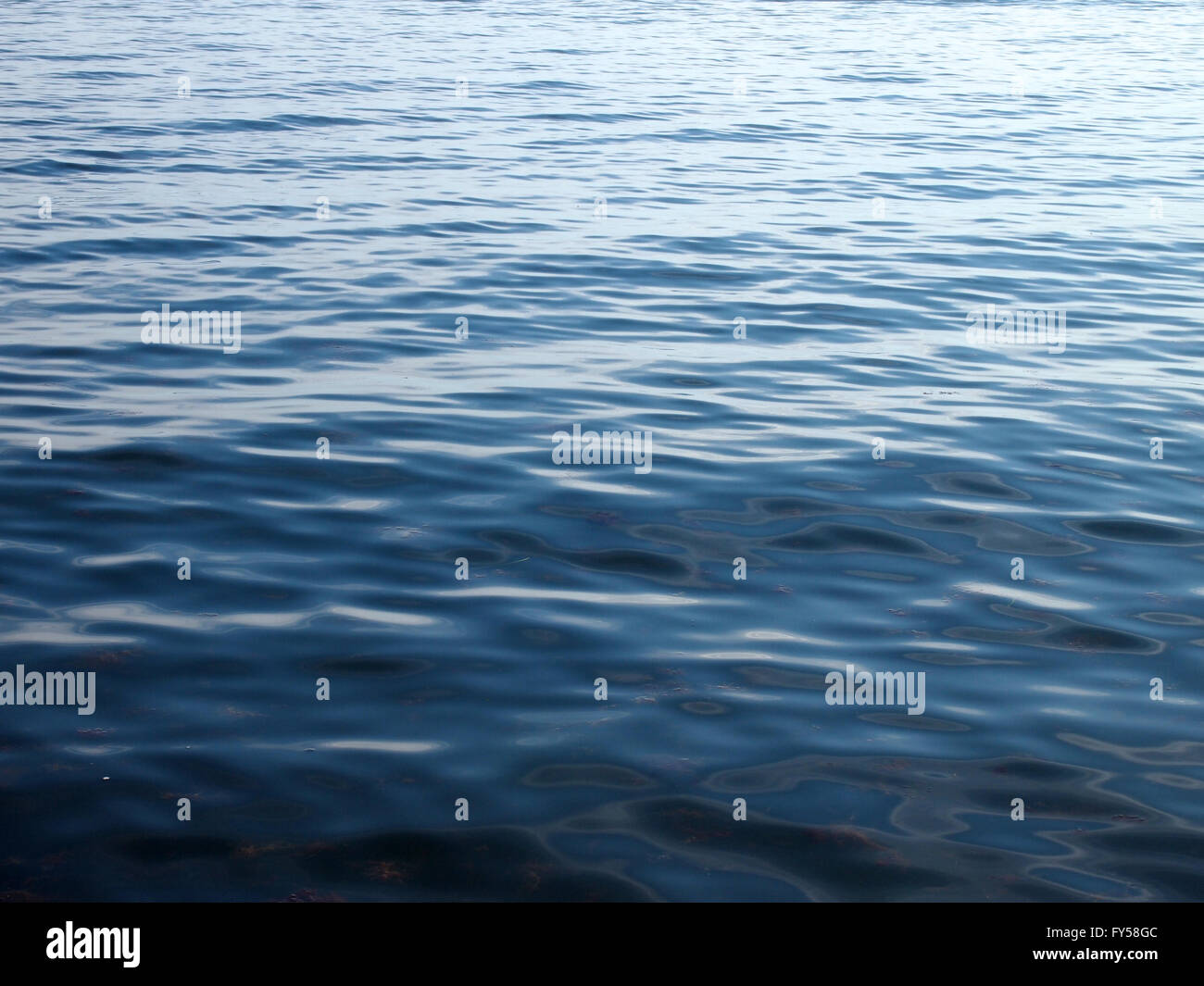 Ocean Water ripples off the coast of Connecticut.  Good for backgrounds textures. Stock Photo