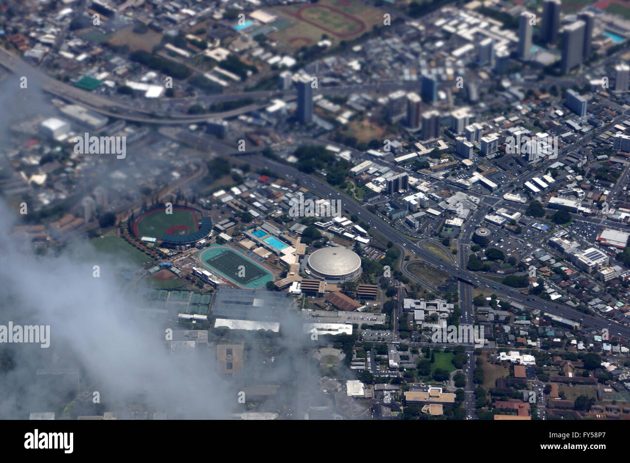 Aerial view of Landmark University of Hawaii Baseball Les Murakami Stadium and Stan Sheriff Center in Manoa with H-1 Highway and Stock Photo