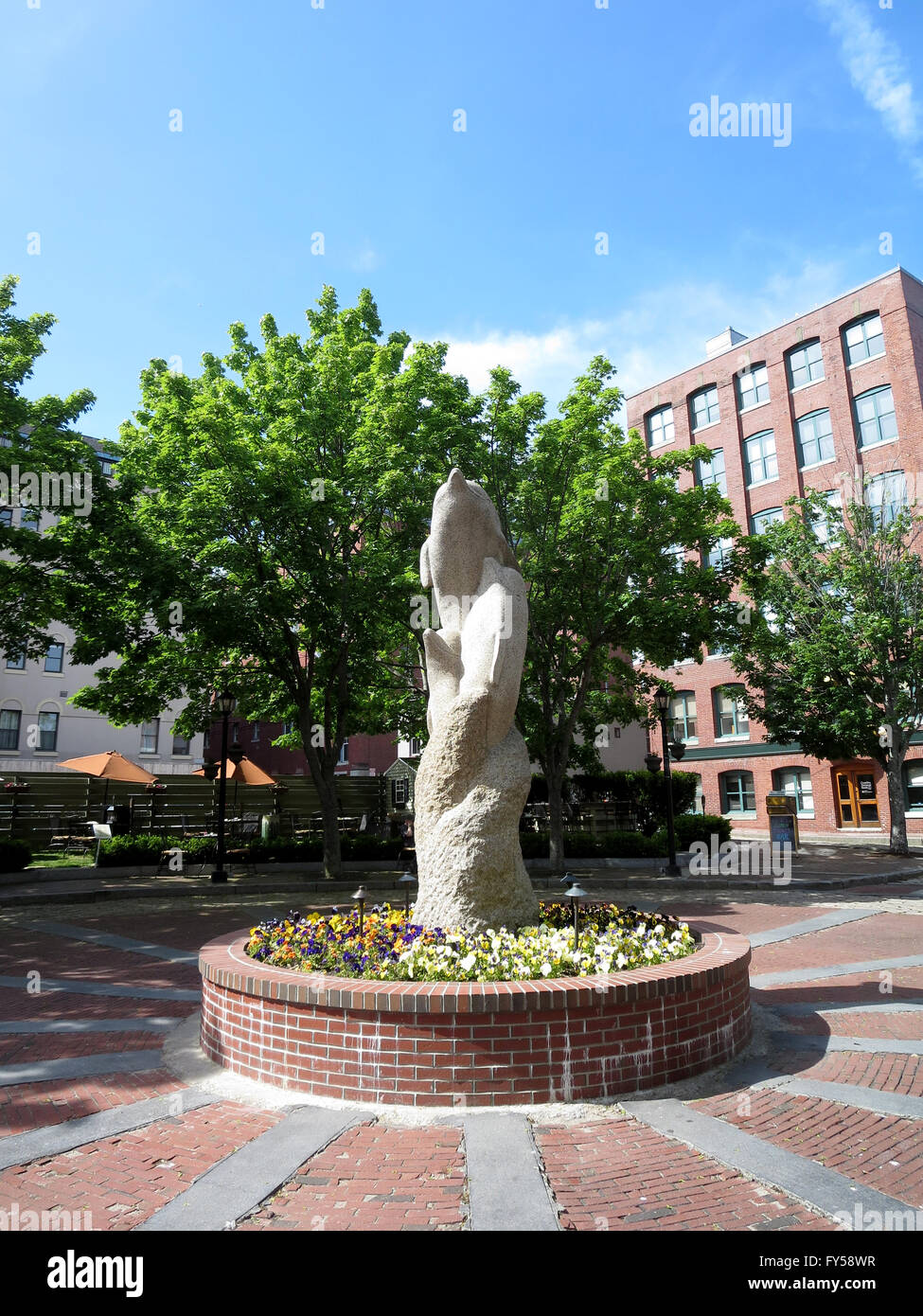 Cement dolphin statue in Square in Portland, Maine Stock Photo Alamy