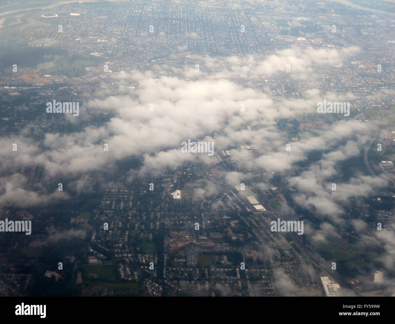Clouds hover over Washington DC area aerial cityscape. Stock Photo