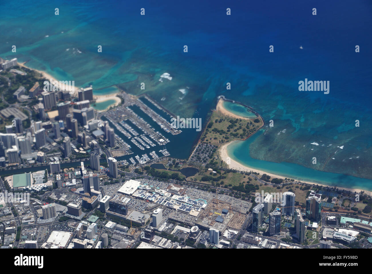 Waikiki, Ala Wai Canal, Ala Moana Mall, Park, Convention Center, Condos, Hotels of Honolulu and Ocean Aerial view during the day Stock Photo