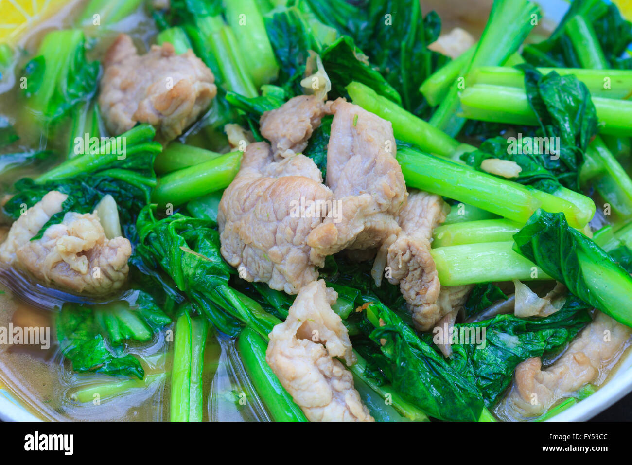 Fried chinese cabbage with pork in oyster sauce, cooking in the Thai