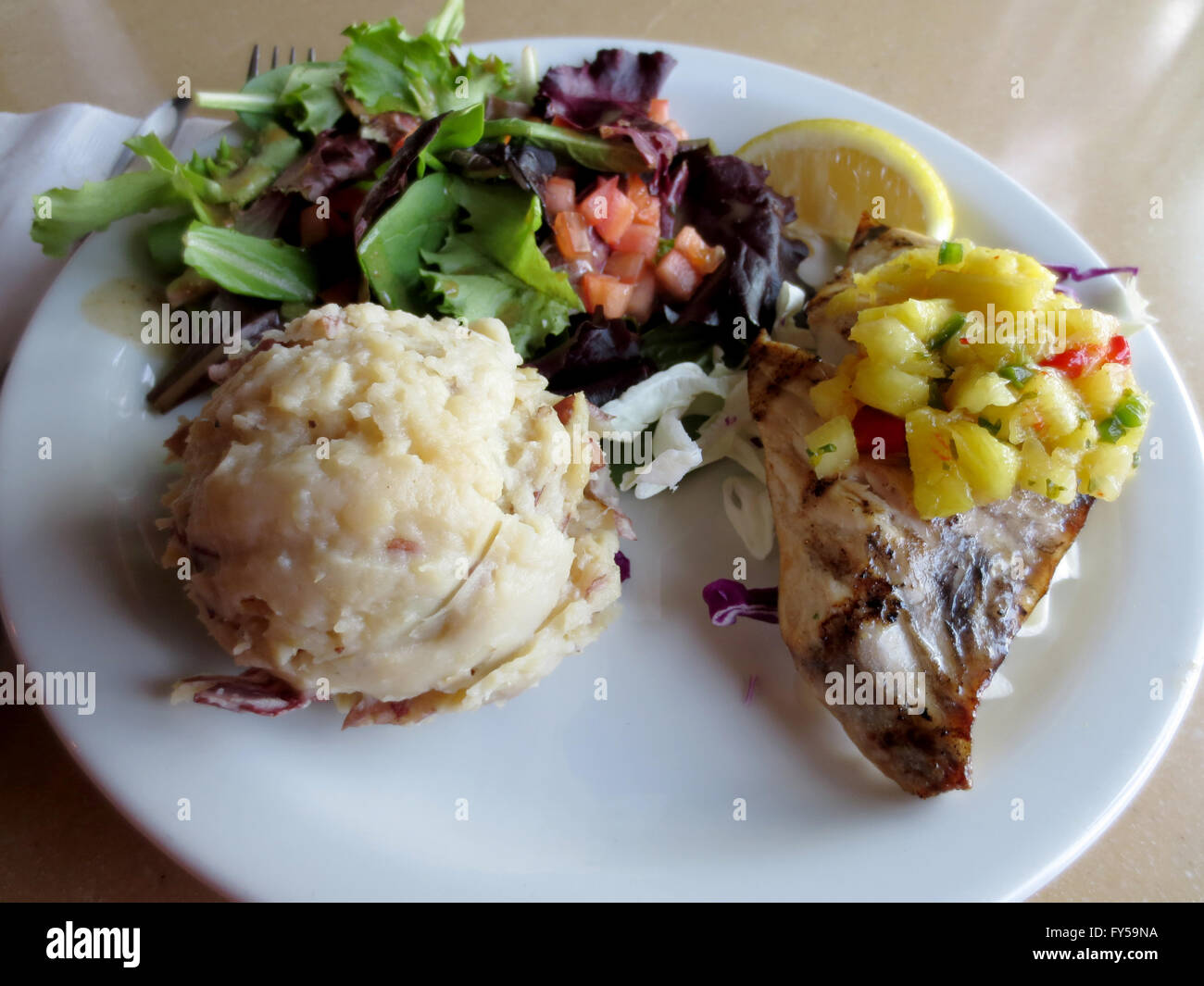 Grilled Fresh Catch fish of the day, with homemade mash potatoes, and Oahu North Shore green