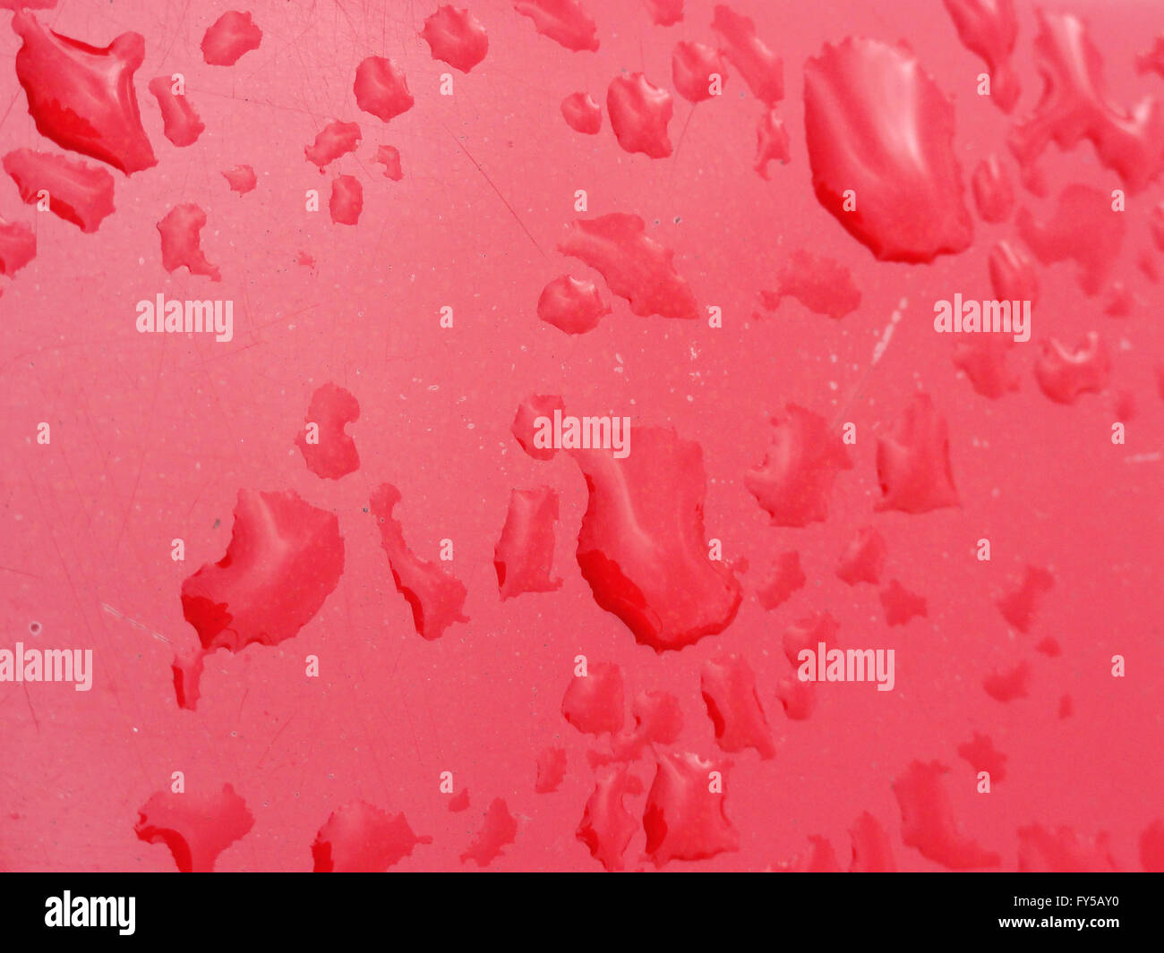 water drops on abstract background with scratches on surface. Stock Photo