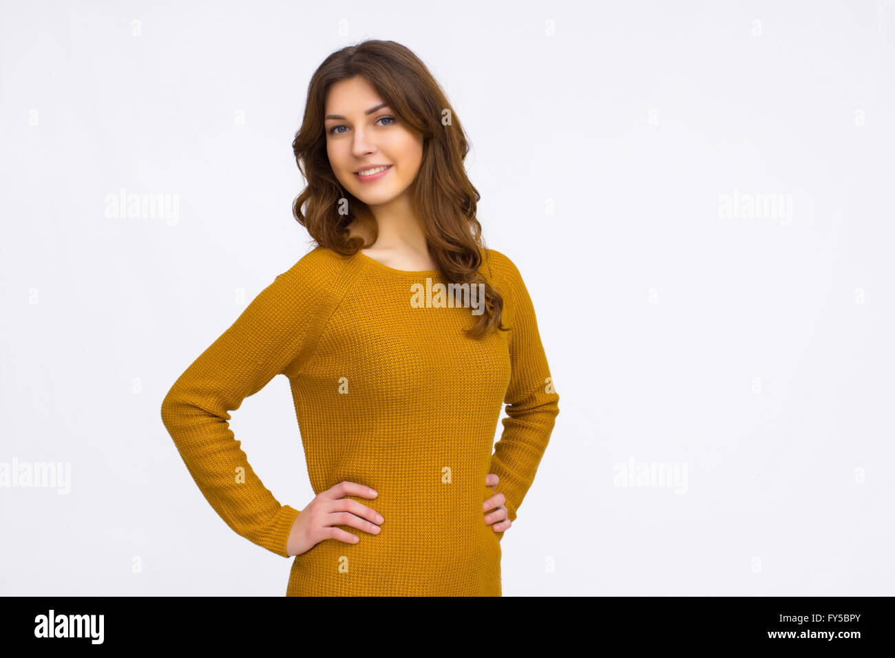 Pretty girl in orange sweater Stock Photo Alamy