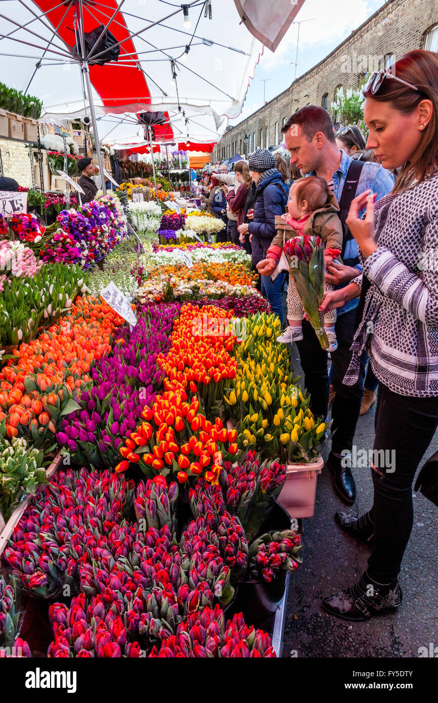 A Family Buying Flowers At Columbia Road Flower Market, Tower Hamlets, London, England Stock Photo