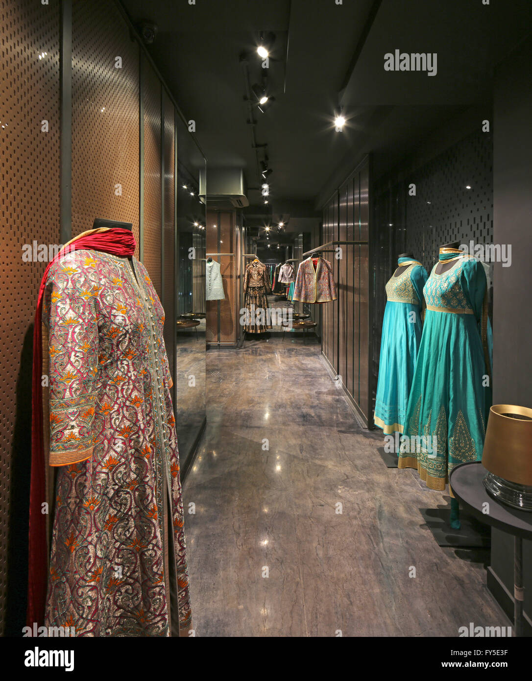 Overall interior view with colourful wedding saris. Abishek Gupta Shop, New Delhi, India. Architect: Studio Lotus, 2016. Stock Photo