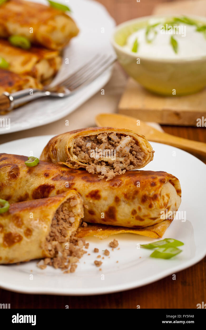 russian-fried-stuffed-pancakes-blintzes-with-meat-stock-photo-alamy